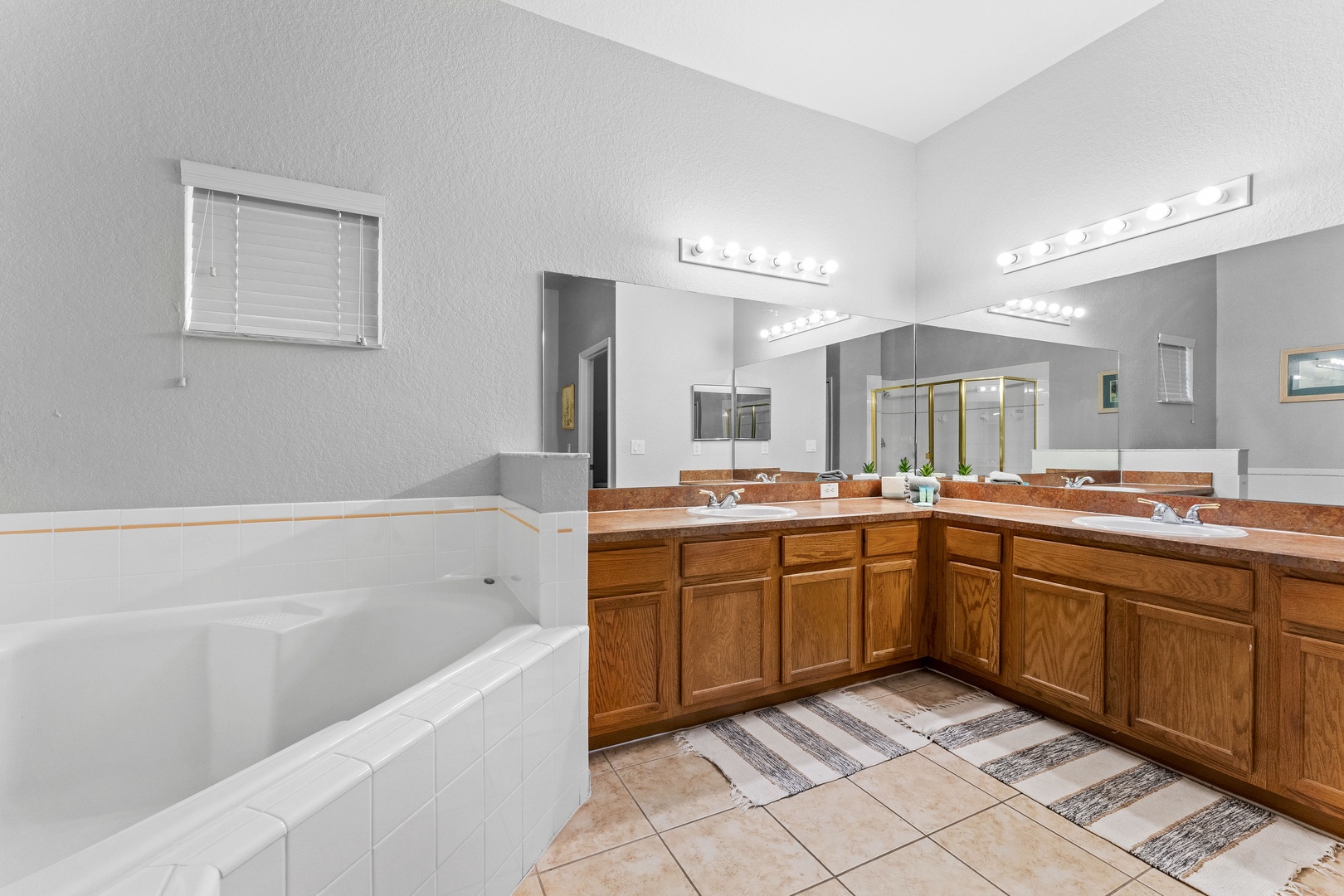 Private ensuite with dual vanity, soaking tub, separate shower