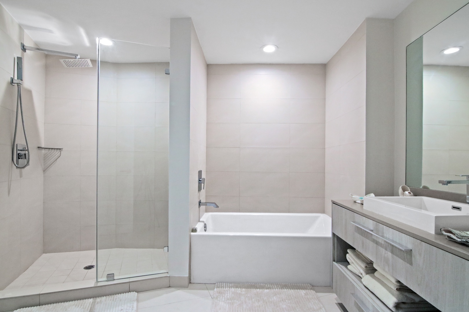 The first king en suite offers a single vanity, glass shower, & soaking tub
