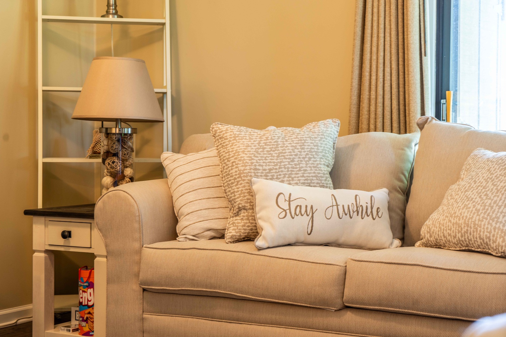 Bright living area with comfy seating and Smart TV