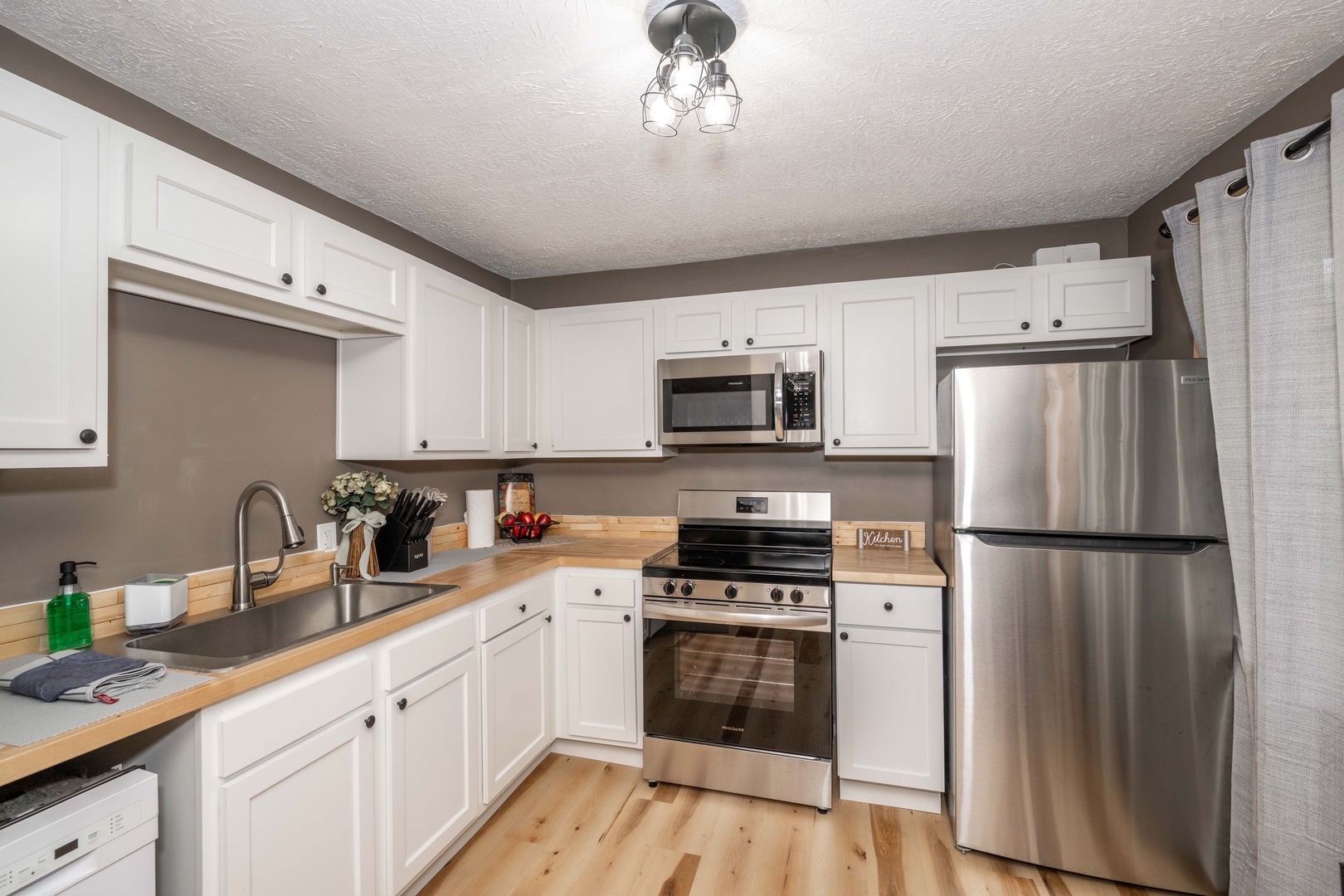 The open, airy kitchen offers ample space & every home comfort