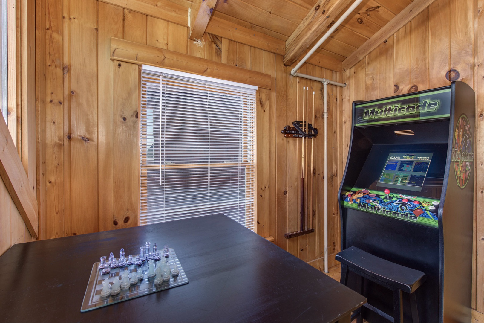 The upper-level loft bedroom is ideal for gaming, with twin bunks & trundle!