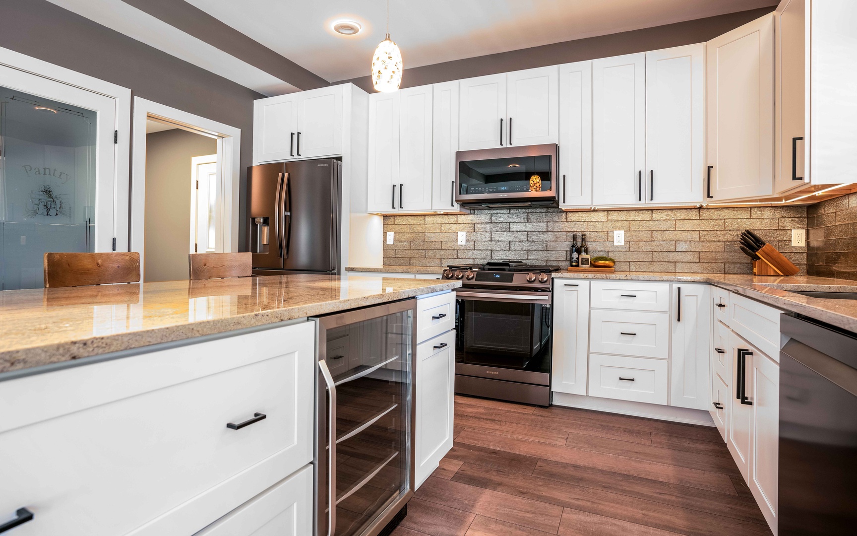 The open, airy kitchen offers ample space & all the comforts of home