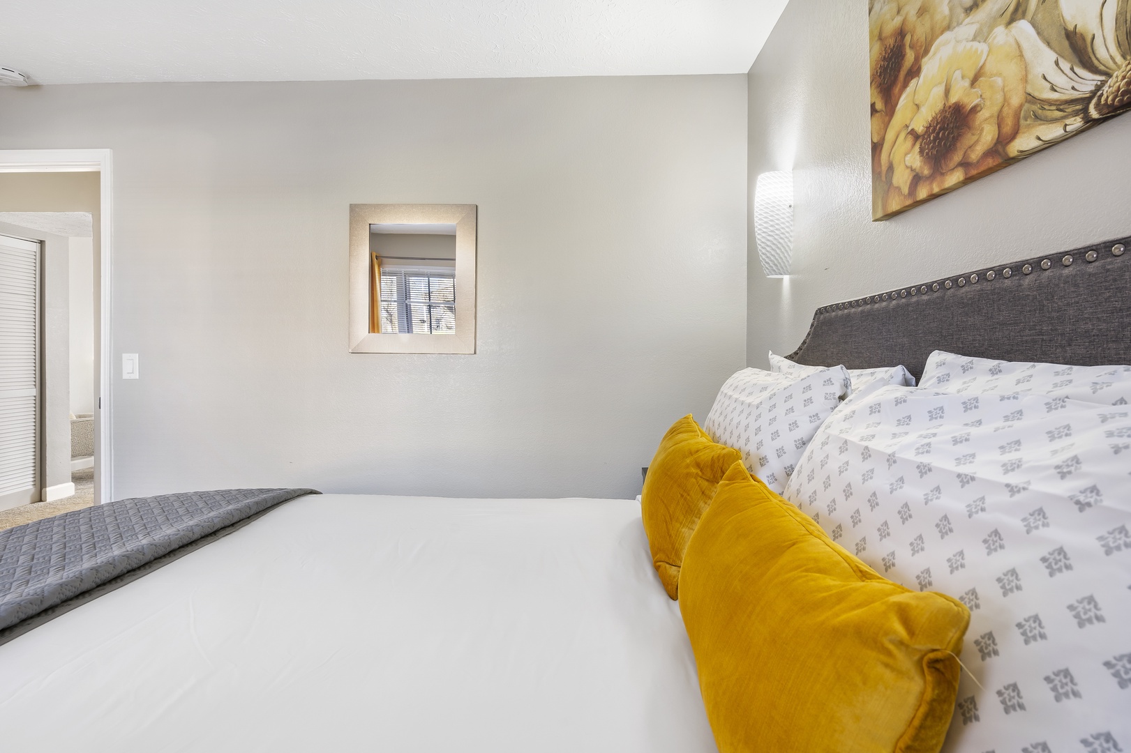 The cheerful suite showcases a private ensuite bath & plush queen bed