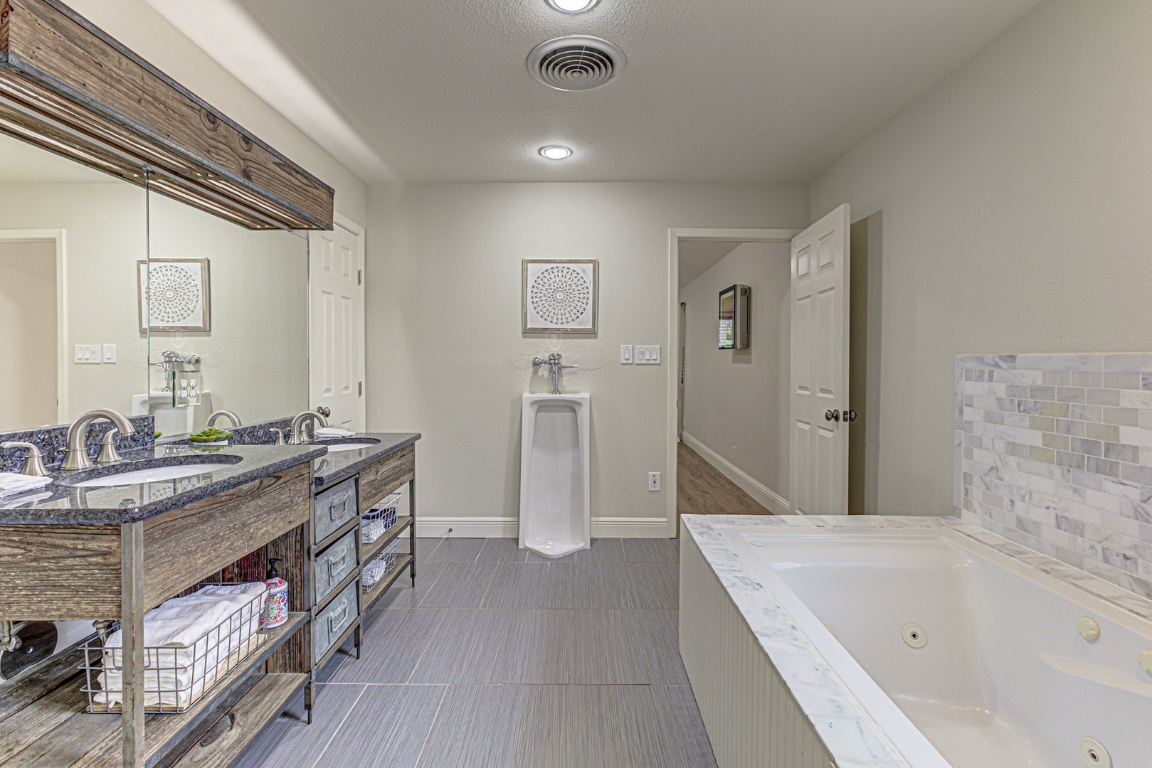 Enjoy a double vanity, soaking tub, & walk-in shower in the king ensuite