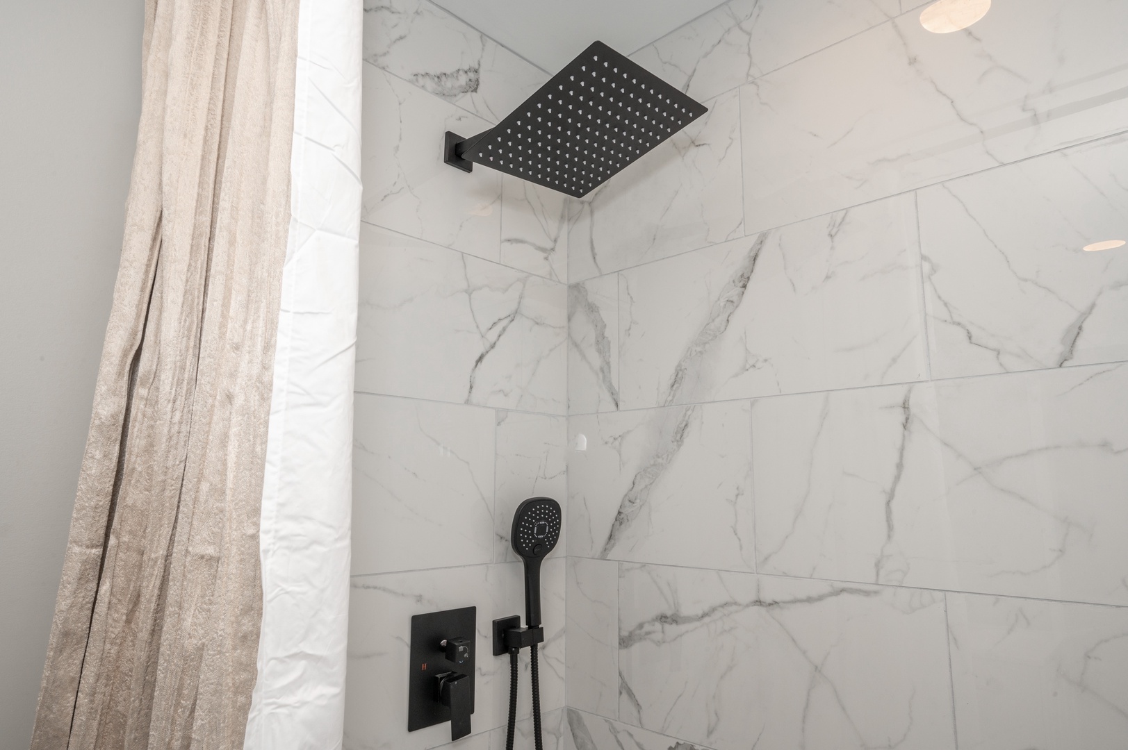 Apt 1 – The full bathroom offers a walk-in shower & chic finishes