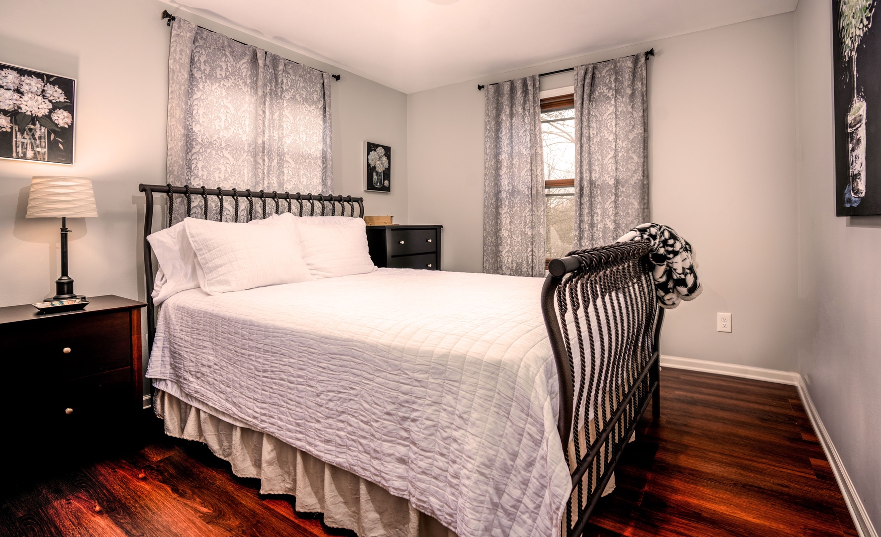 The final main-level bedroom offers a regal queen-sized bed