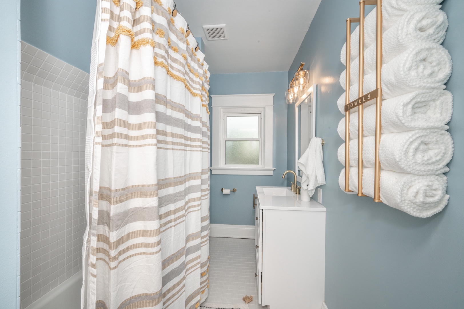 The 2nd floor full bathroom offers a single vanity & shower/tub combo