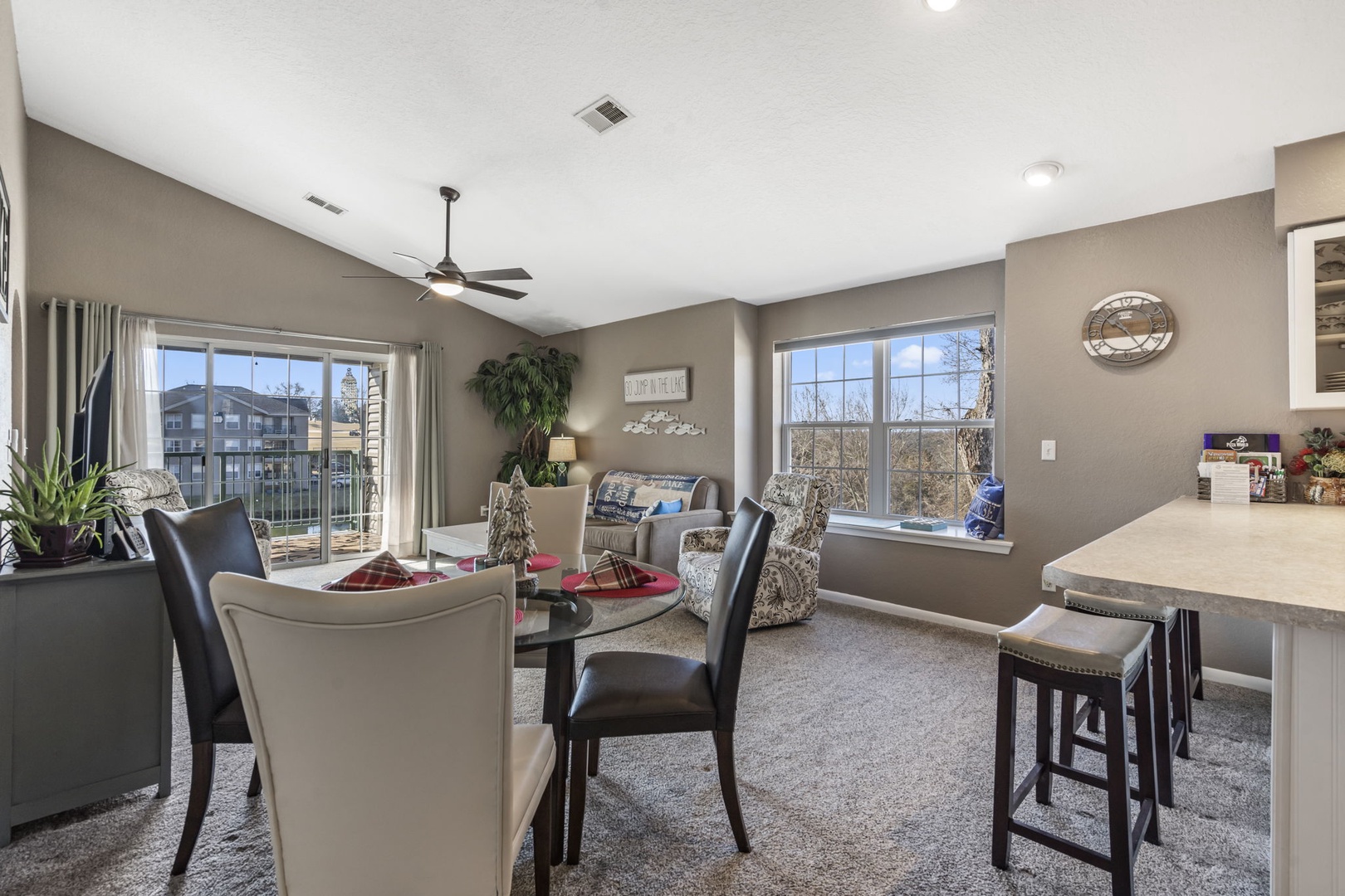Open living space with sofa sleeper, Smart TV, and dining area