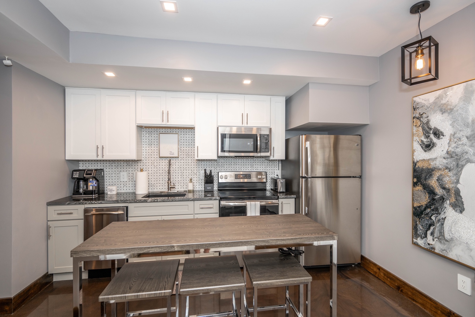 The stylish kitchen offers ample space & all the comforts of home