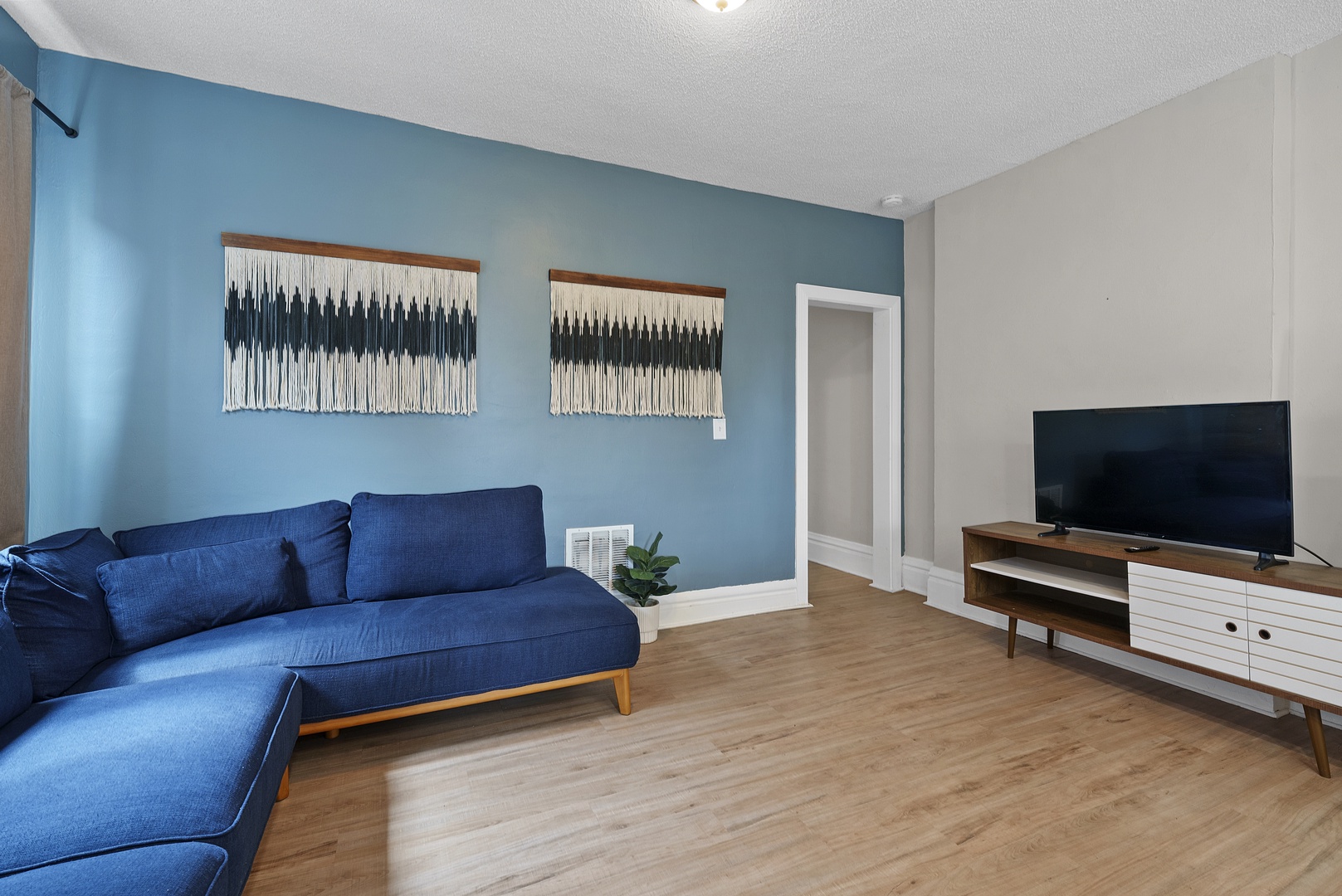 Lounge the day away while you stream your favorites in Apartment 1166.5’s living room