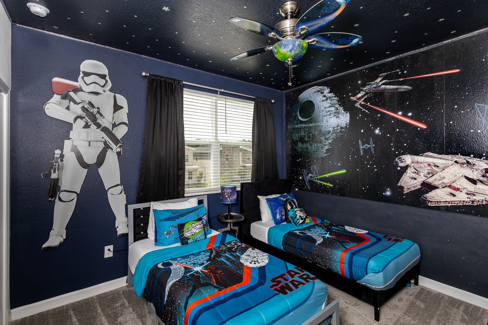 Feel the force in this 2nd-floor bedroom, offering two twin beds & a smart TV