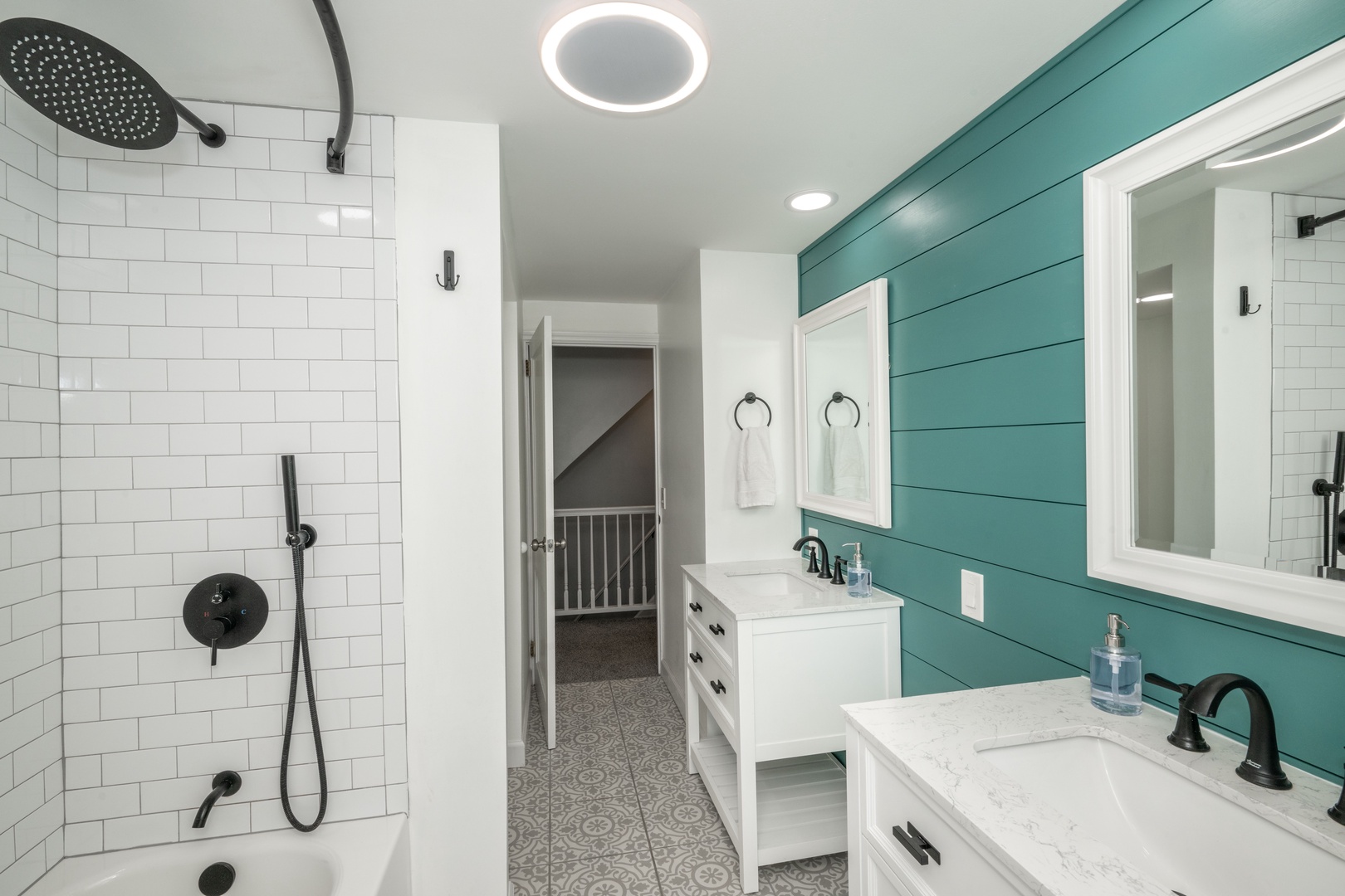 The second-floor full bath includes dual vanities & a shower/tub combo