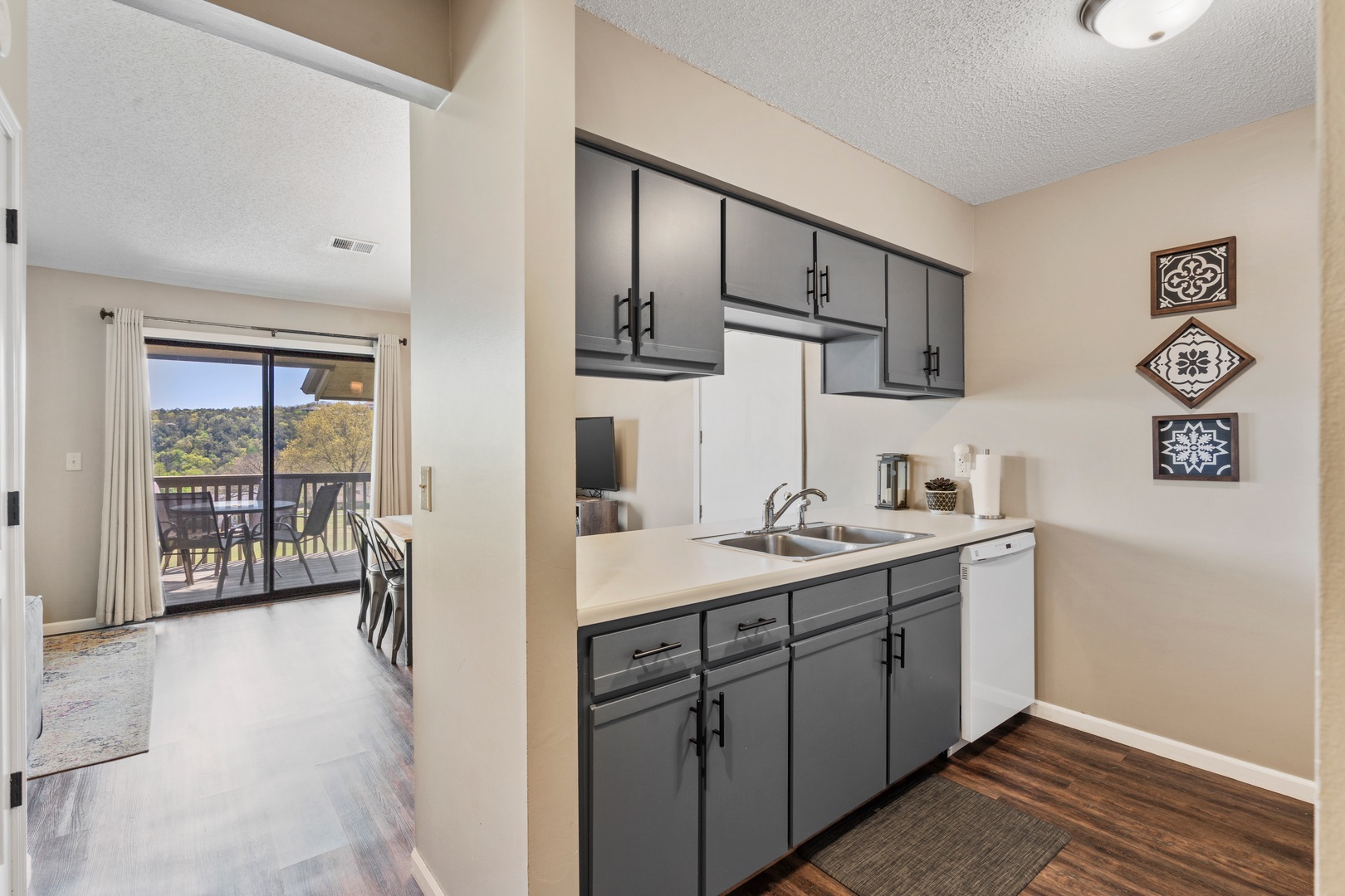 The airy kitchen offers ample space & all the comforts of home