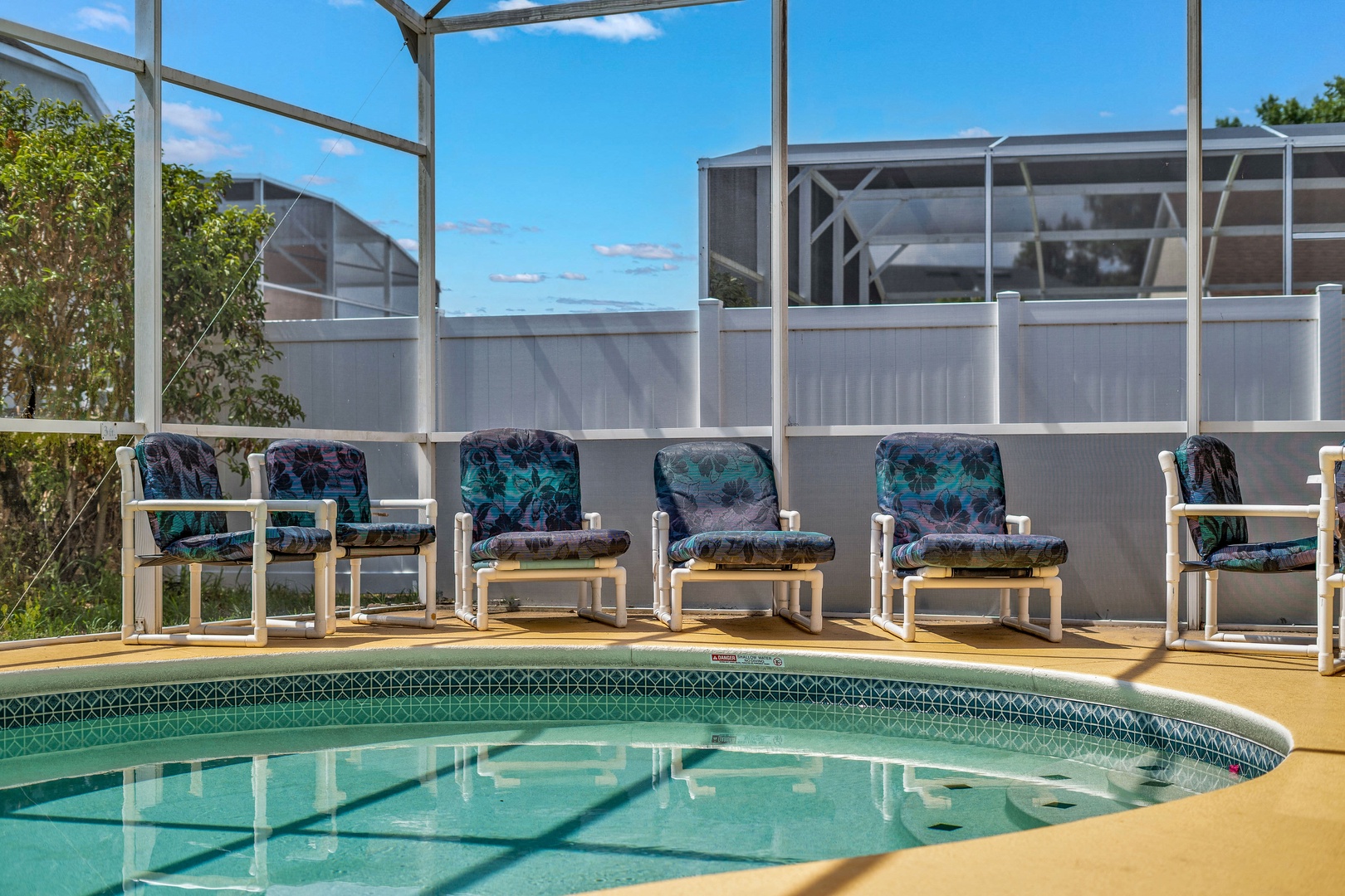 Private screened pool with outdoor seating