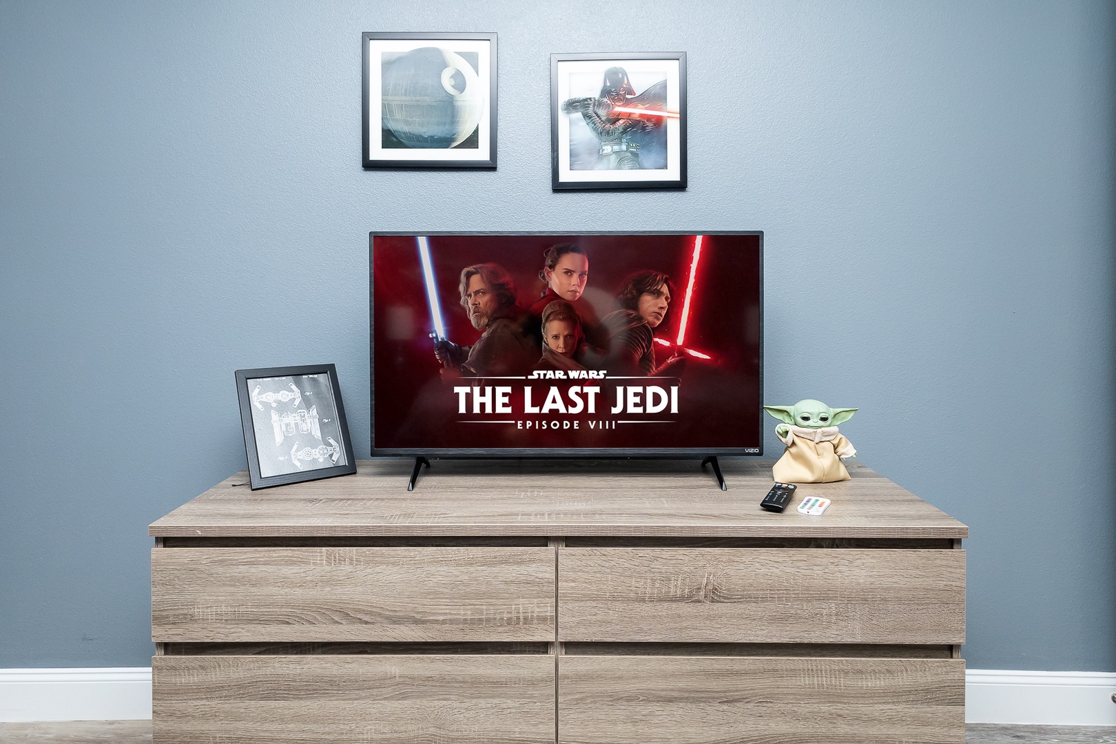 This queen bedroom with a Smart TV will take you to a galaxy far, far away