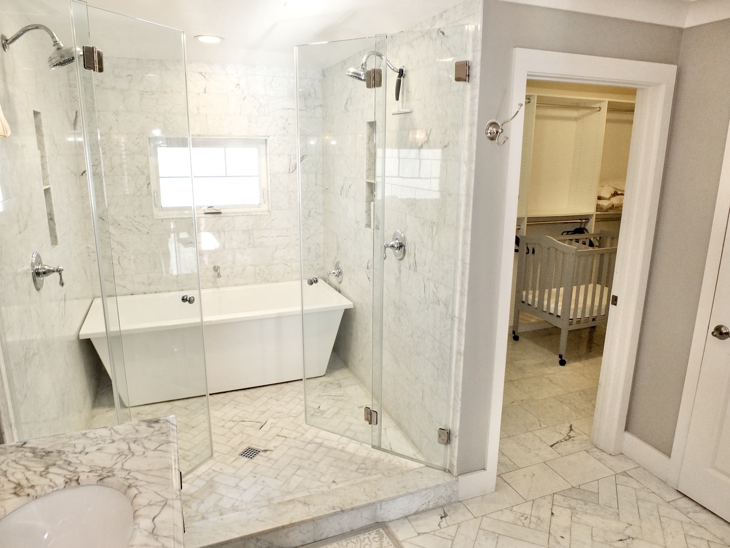 The king ensuite boasts a double vanity, spa-like shower, & soaking tub