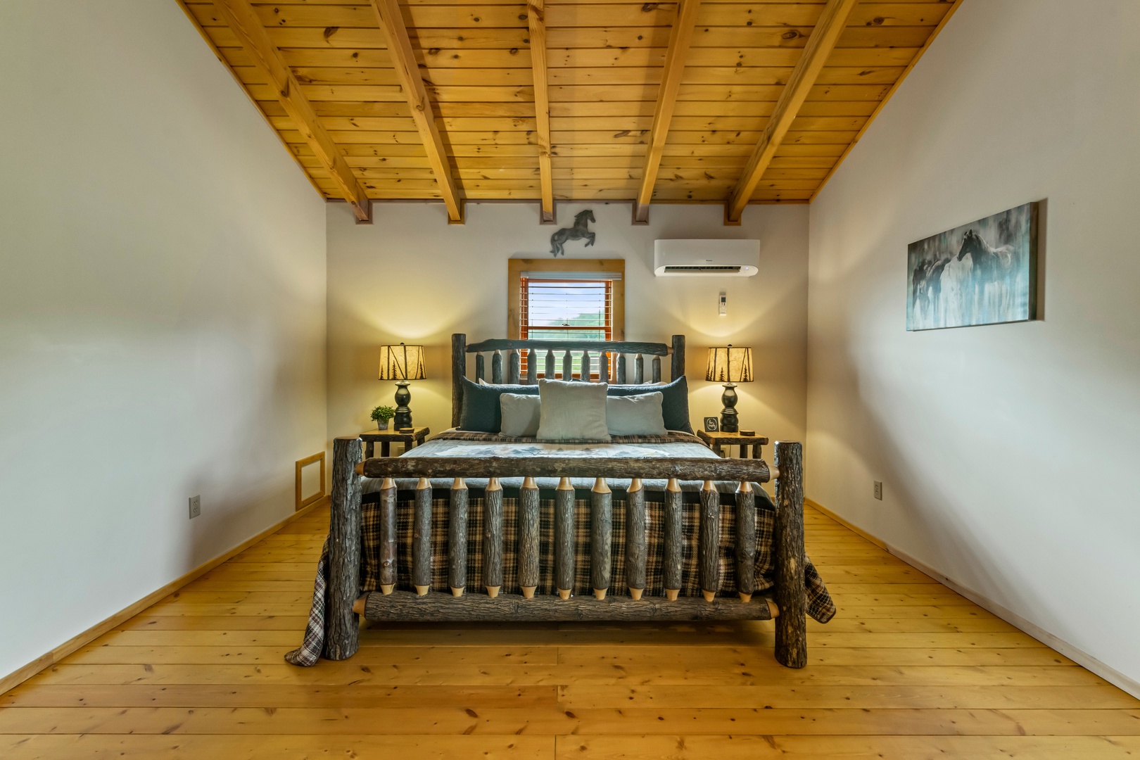 The second-floor bedroom sanctuary showcases a king bed & smart TV