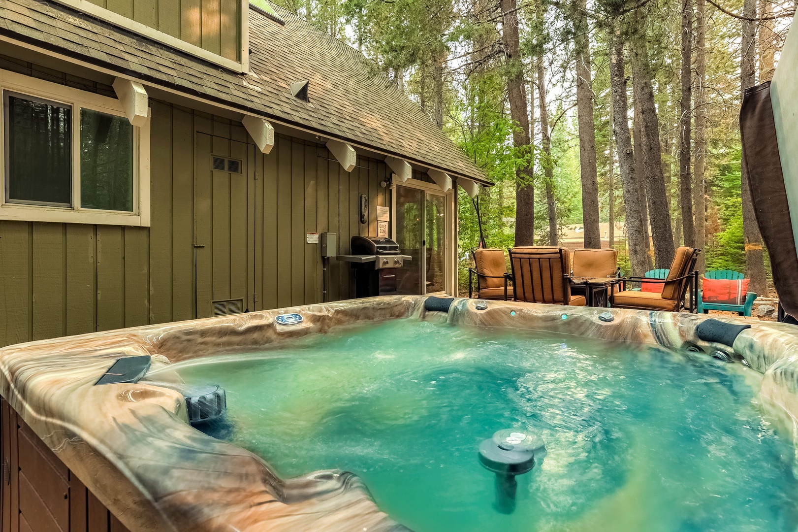Backyard with gas BBQ grill, hot tub and seating