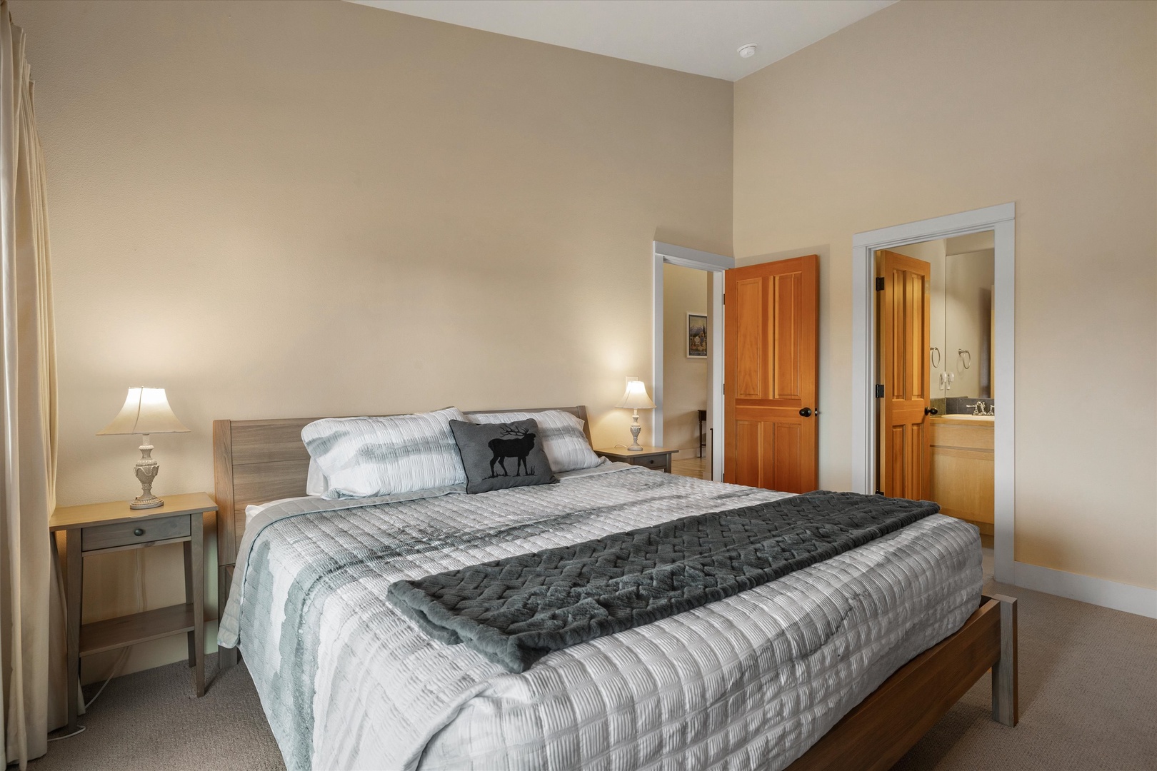 The spacious king suite boasts a private ensuite, TV, & desk workspace