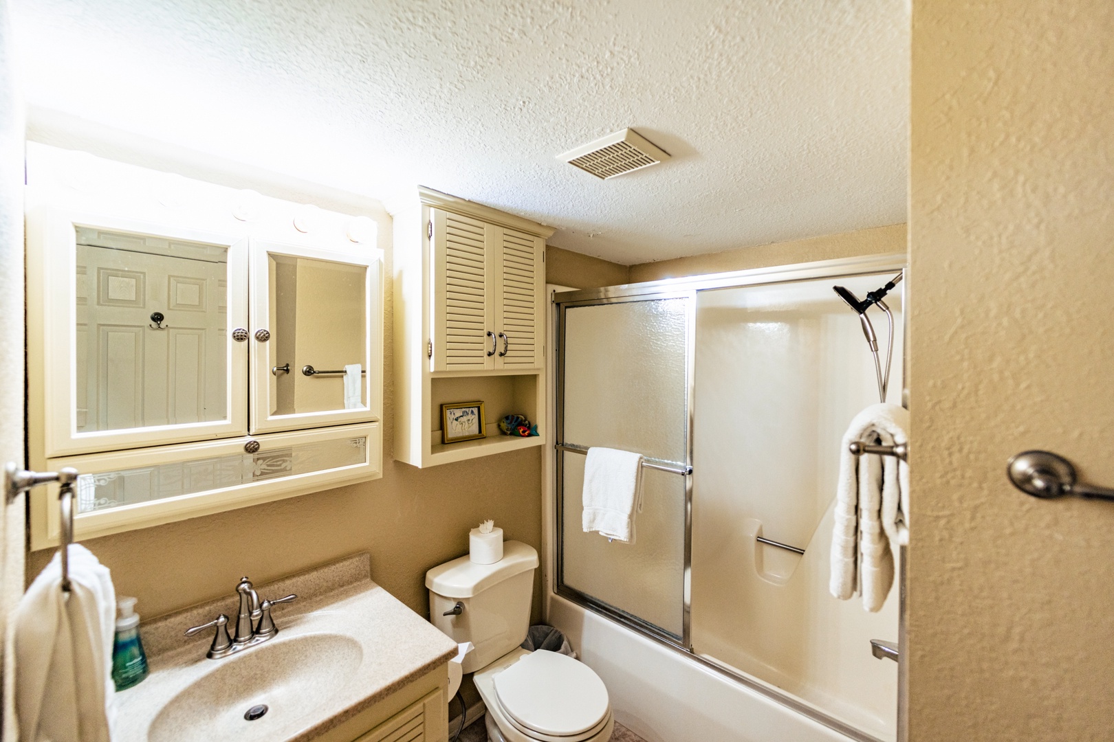 The queen ensuite includes a single vanity & shower/tub combo