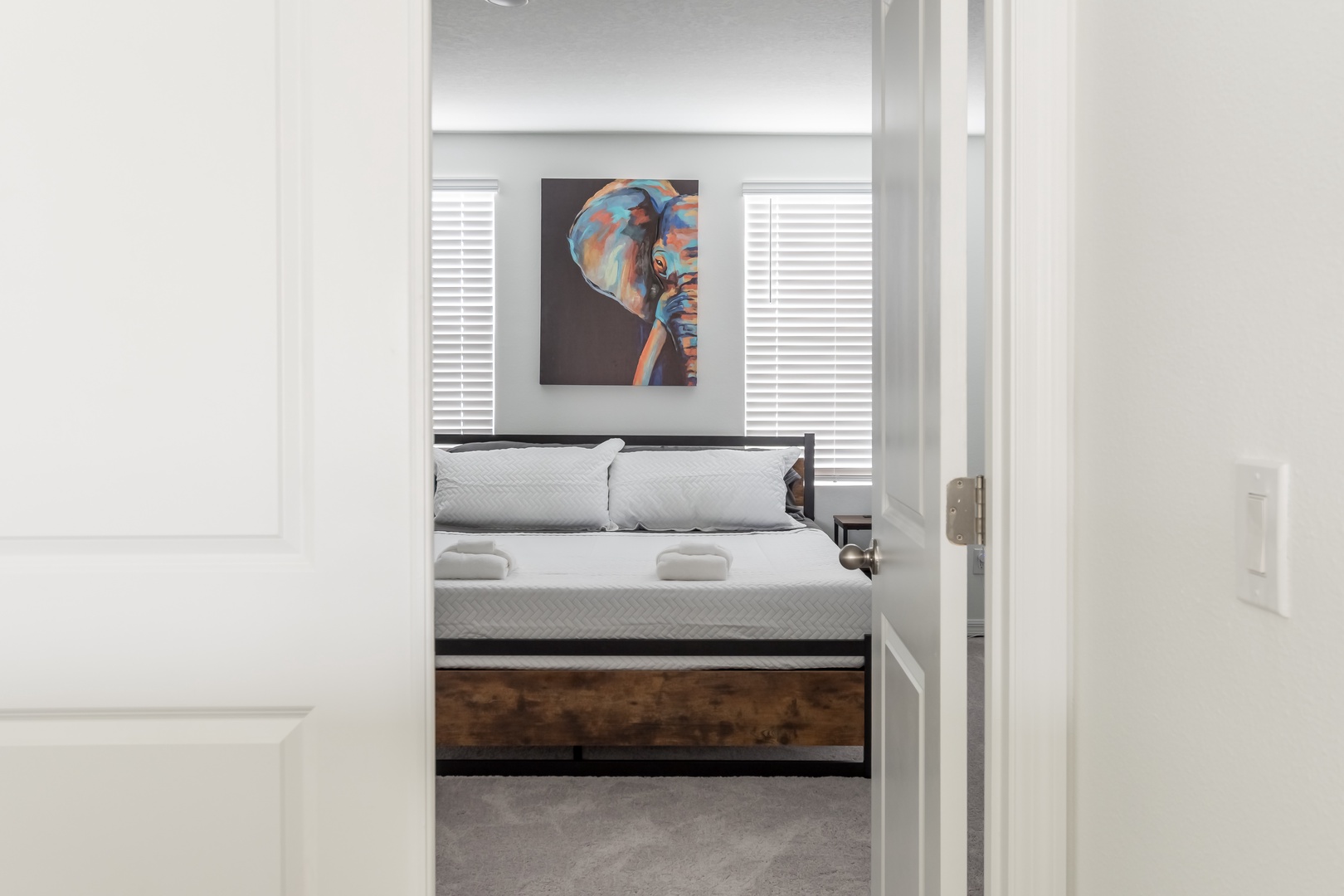 The primary master suite boasts a king bed, private ensuite, & Smart TV