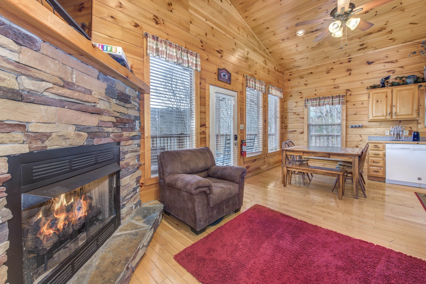Living room with fireplace, and deck access (mid level)