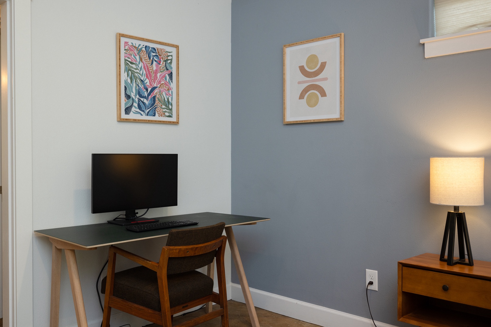 Catch up on emails in the master bedroom with a convenient desk setup!