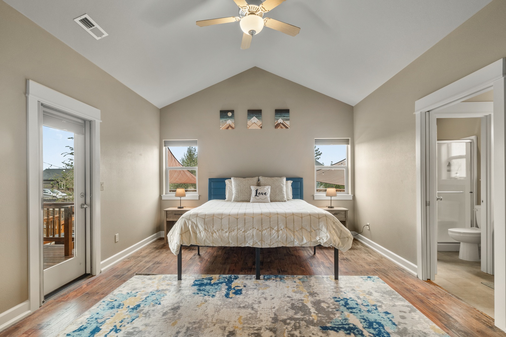 The master suite offers a king bed, private en suite, Smart TV, & patio access
