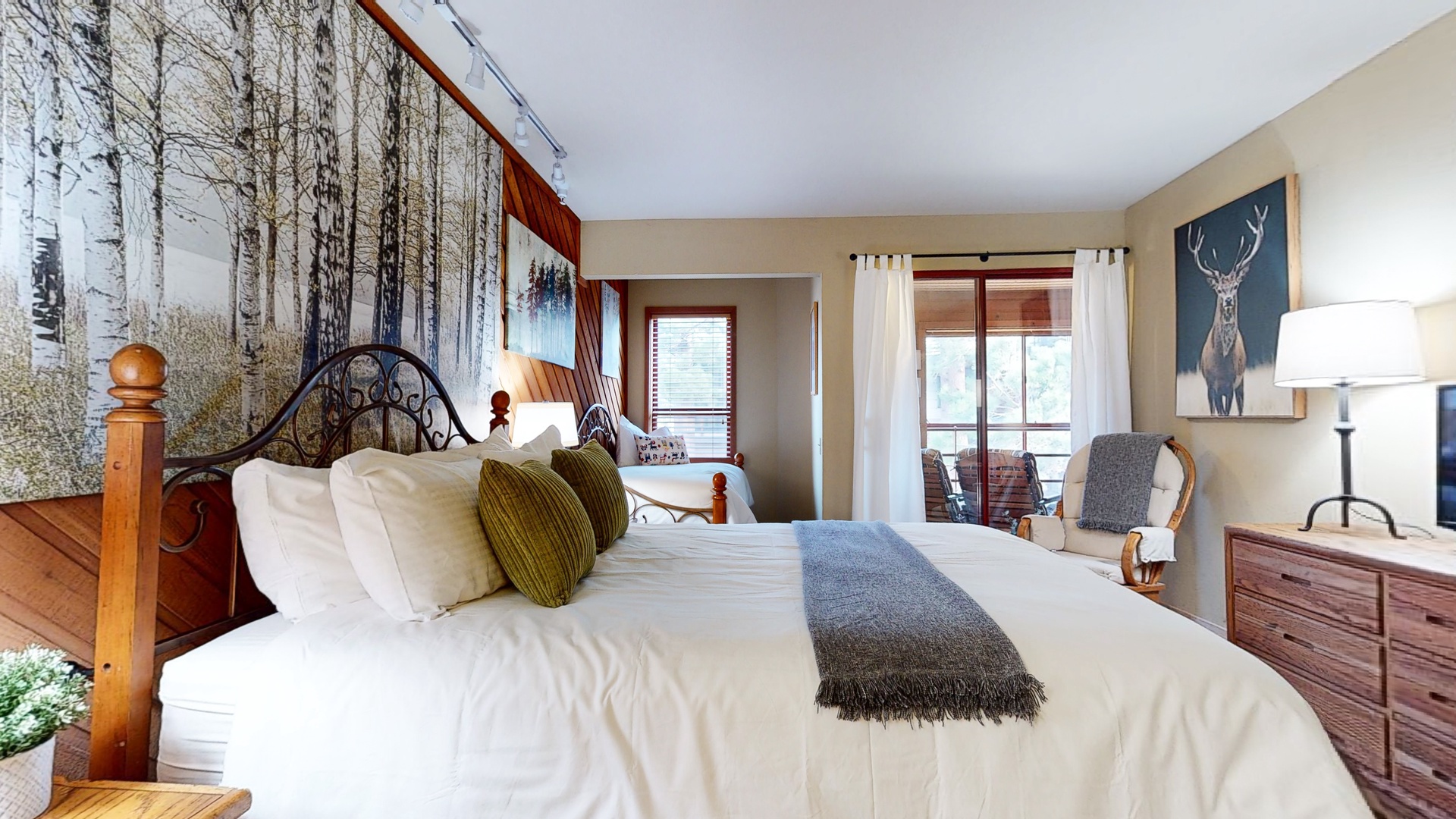 Bedroom 2 with Queen bed, Twin bed, balcony access, and en-suite