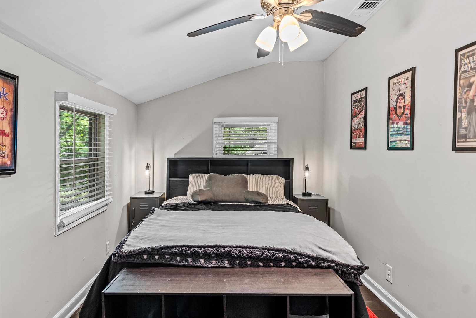 The main bedroom offers a queen-sized bed & ceiling fan