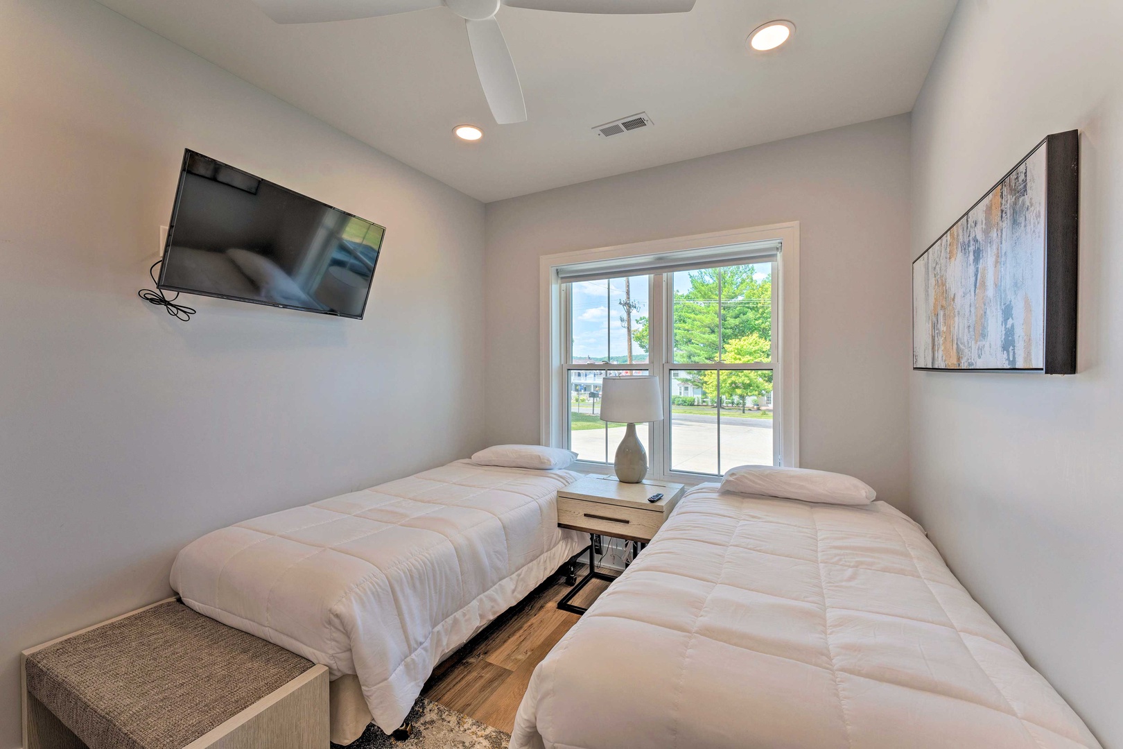 The first bedroom sanctuary features a pair of cozy twin beds & Smart TV
