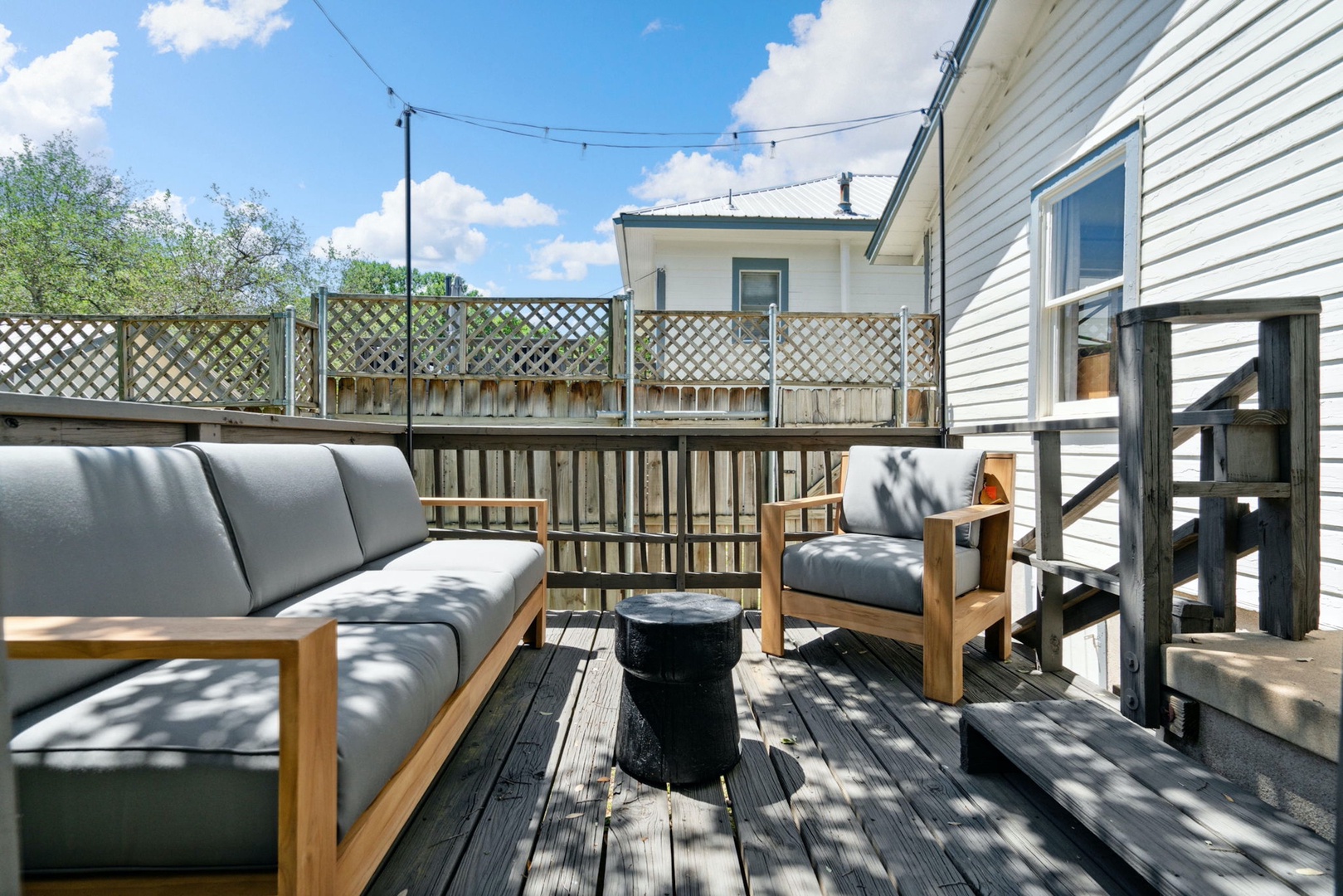 Kick back & relax in the sunshine on the Guest House’s cozy back deck!