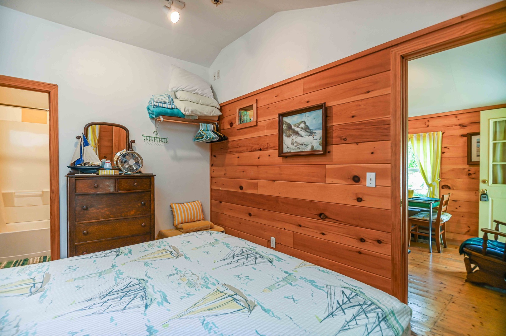 Enjoy serene vibes and natural textures in this wooden queen bedroom