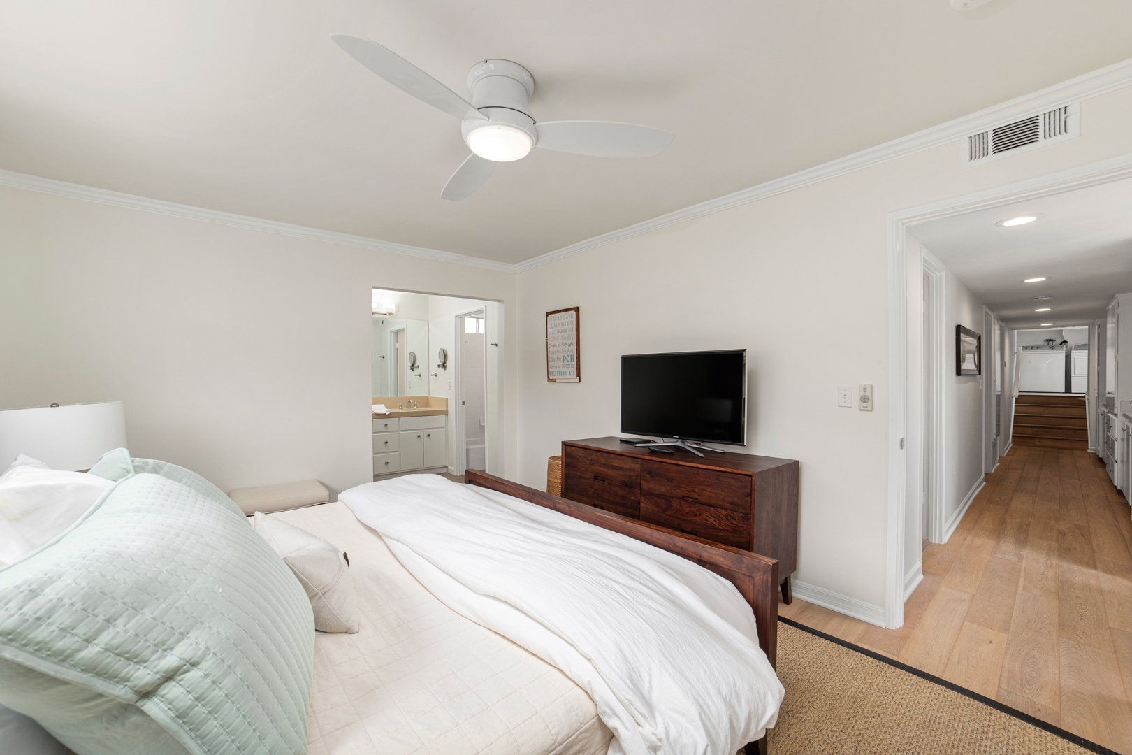 Recharge in the final bedroom, offering a king bed, smart TV, & ensuite