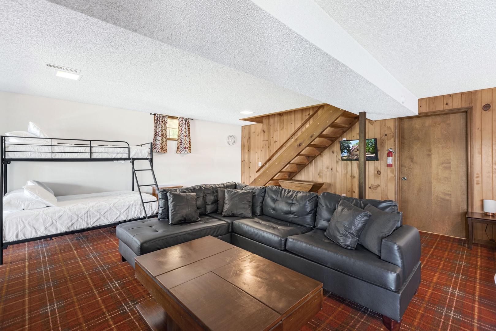 The lower level offers space galore, 1 King, 1 Queen, 1 Twin & room to hang out!