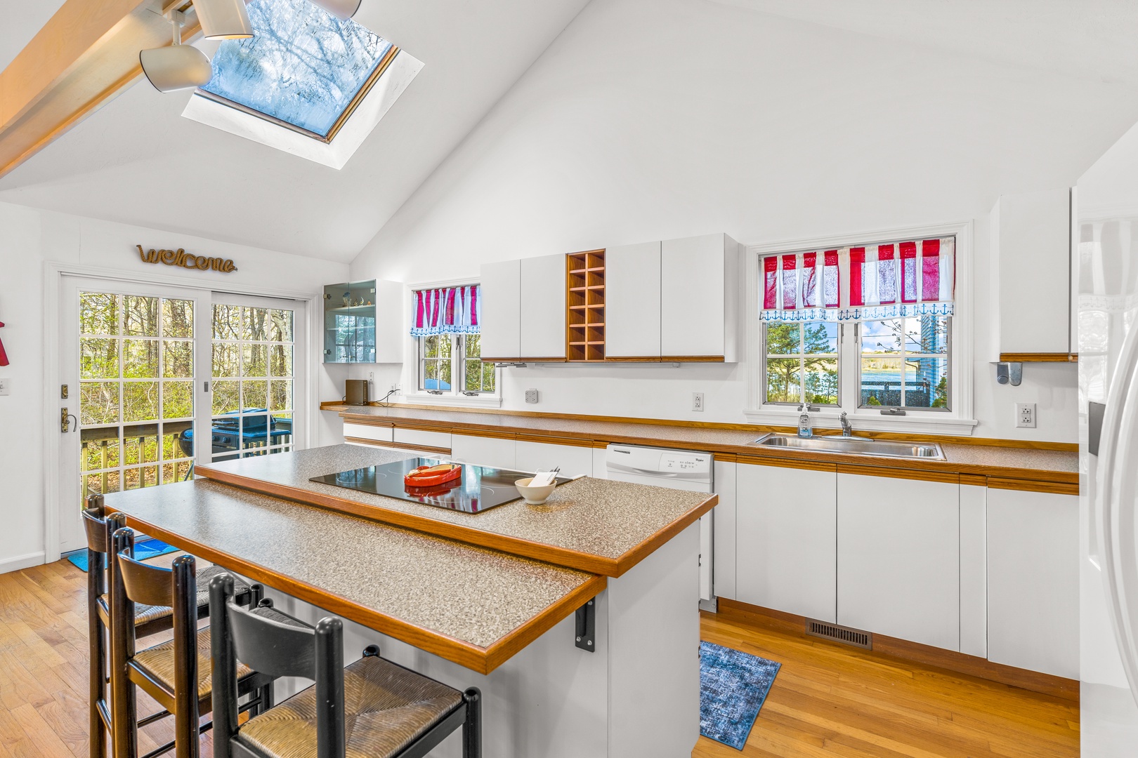 The bright, open kitchen offers ample space & all the comforts of home