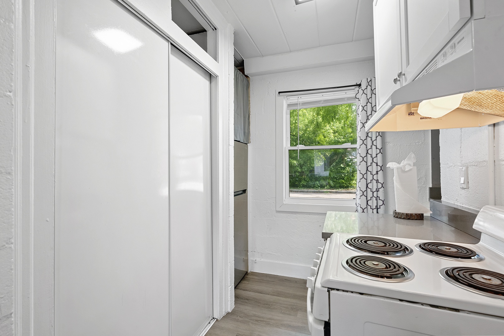 The cozy kitchen offers ample storage space & all the comforts of home