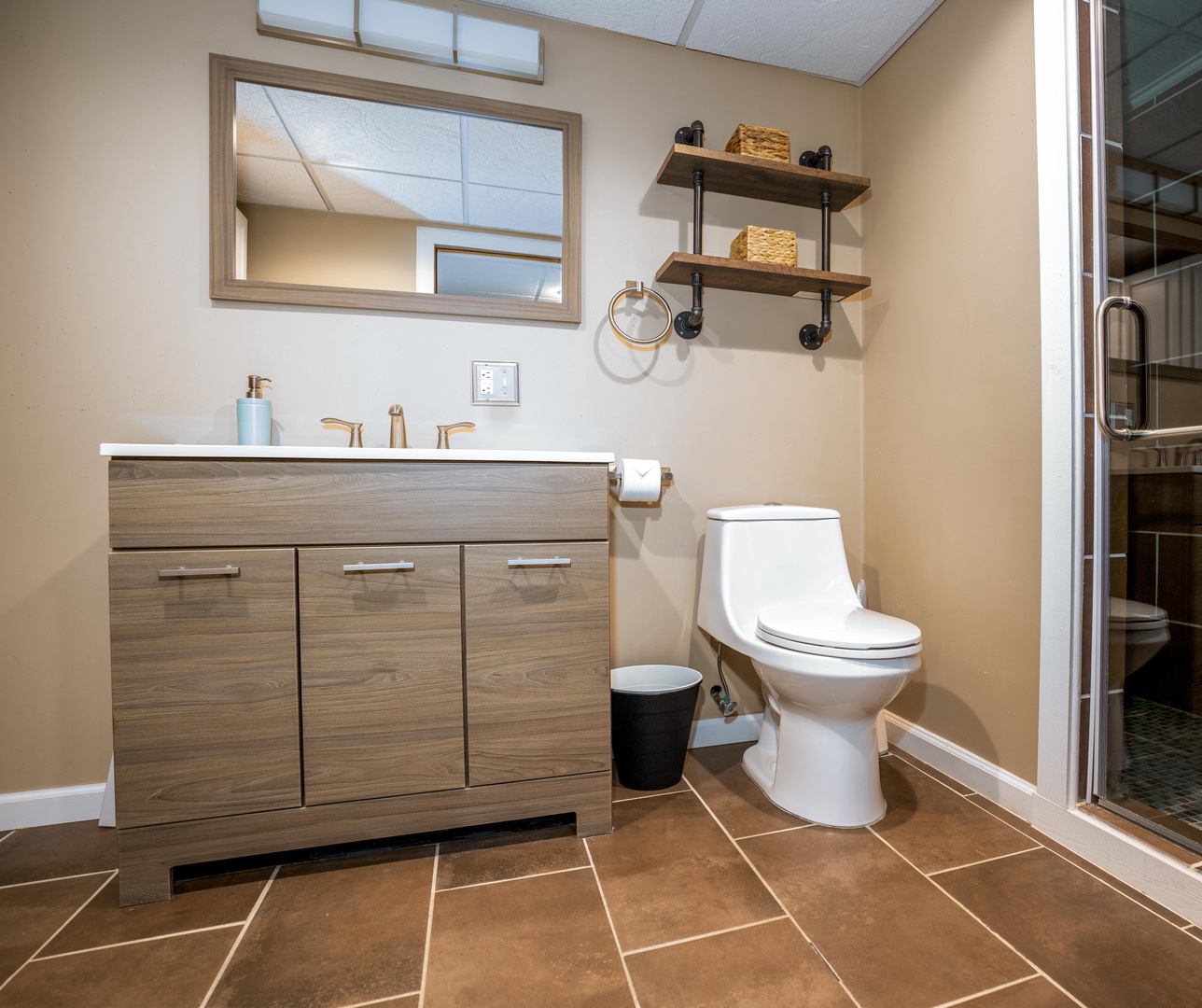The second shared bathroom boasts a single vanity & walk in shower