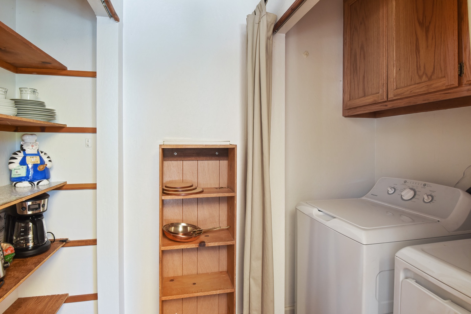 At the End of the Open Kitchen is the Pantry and Full-Size Washer and Dryer