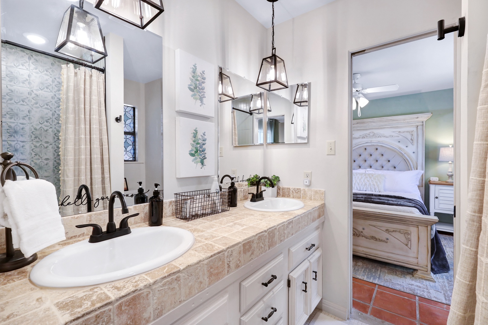 Dual vanities and a walk-in shower await in this Jack & Jill bath