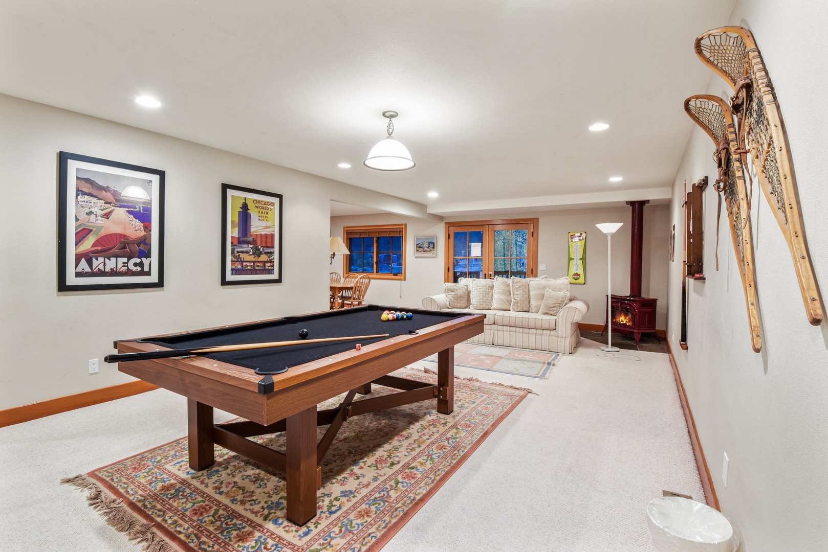 2nd floor den with pool table, dining table, and fireplace