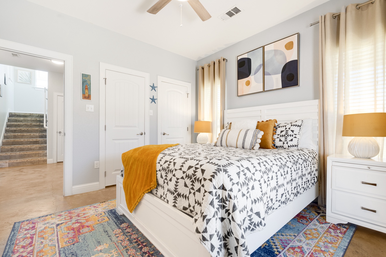 The 1st Floor Queen Bedroom offers patio access, a private En Suite, and Smart TV