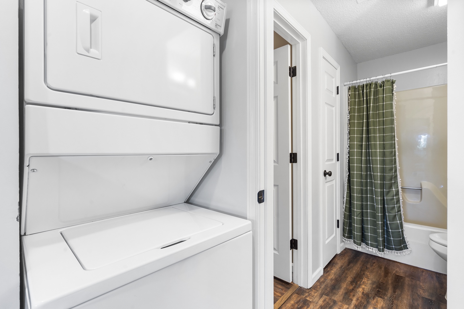 Private laundry is available for your stay, tucked away off the bedroom