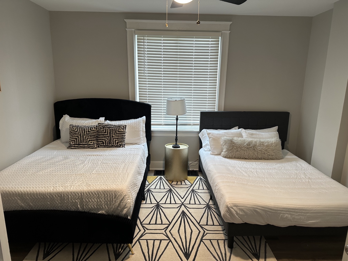 Apt 1 – The comfortable bedroom includes 2 queen beds & ceiling fan