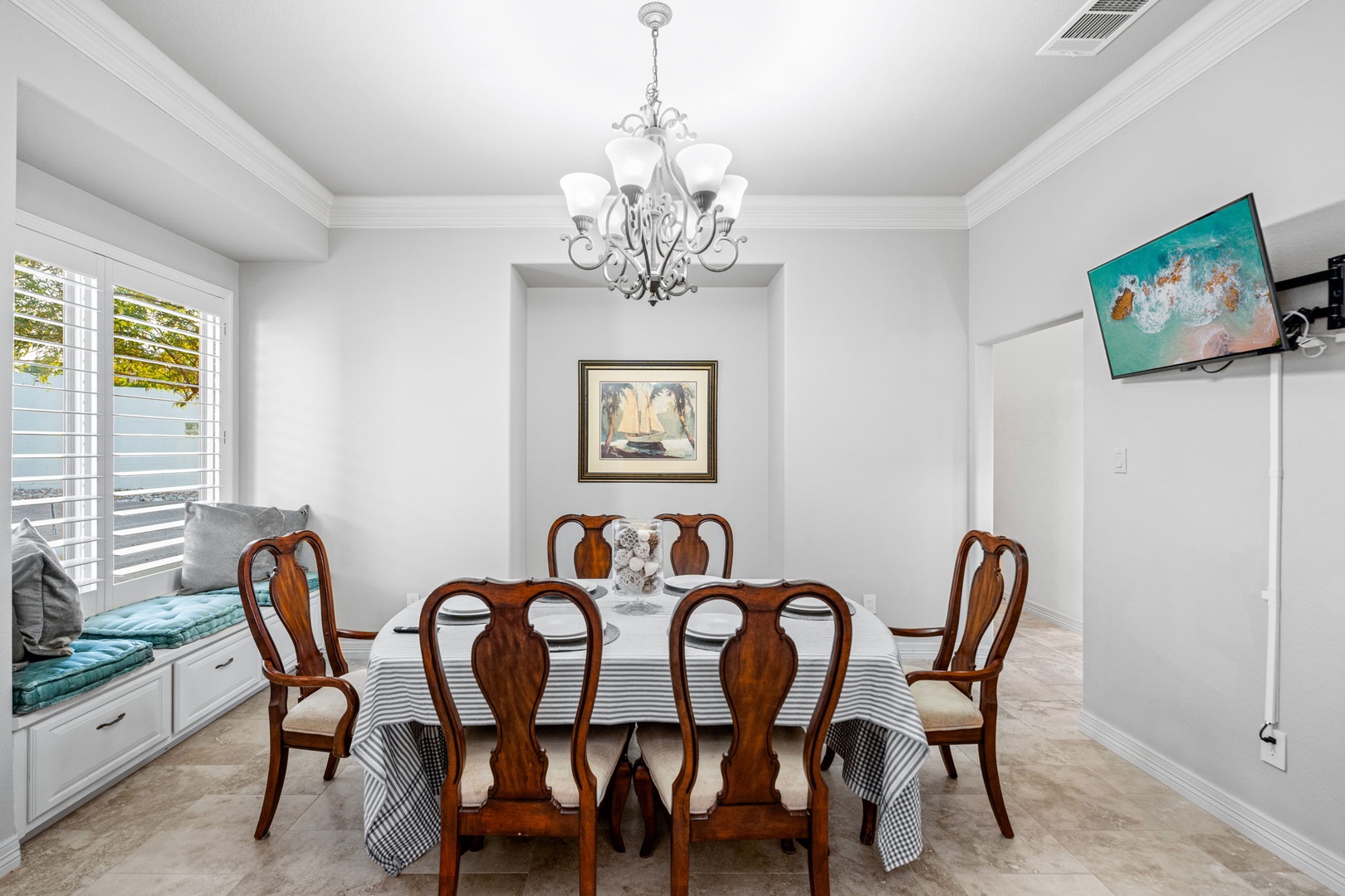 Gather for more formal meals at the dining table, offering seating for 6