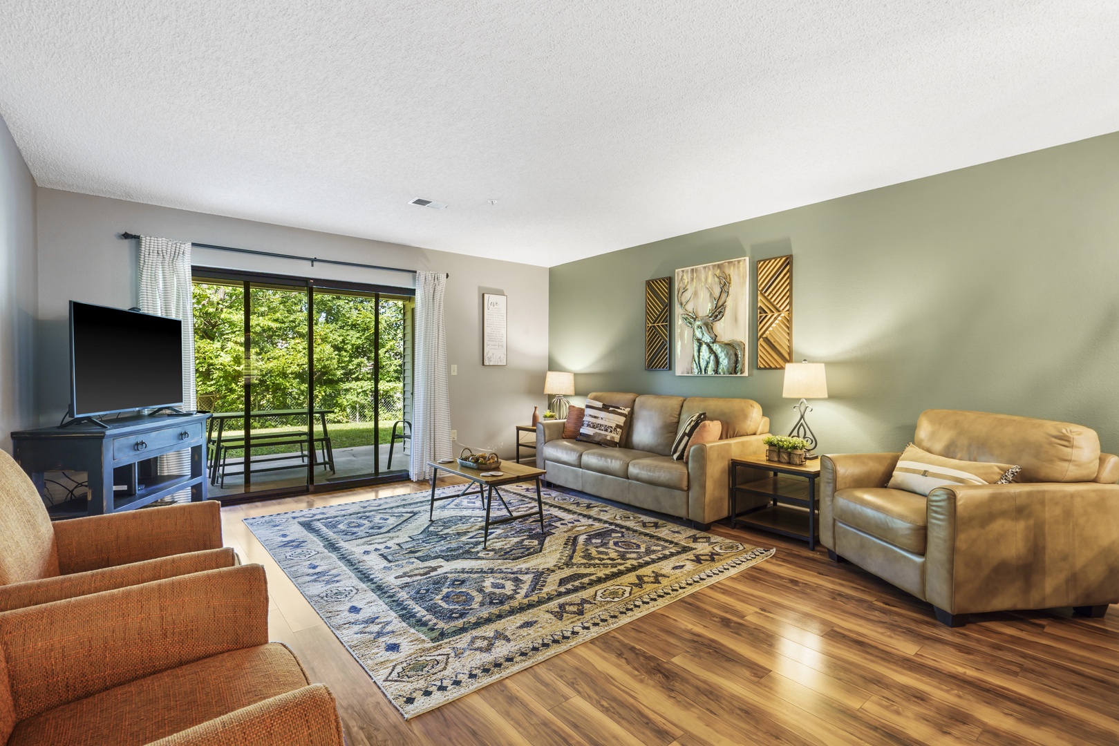 Bright living area with sofa sleeper and Smart TV