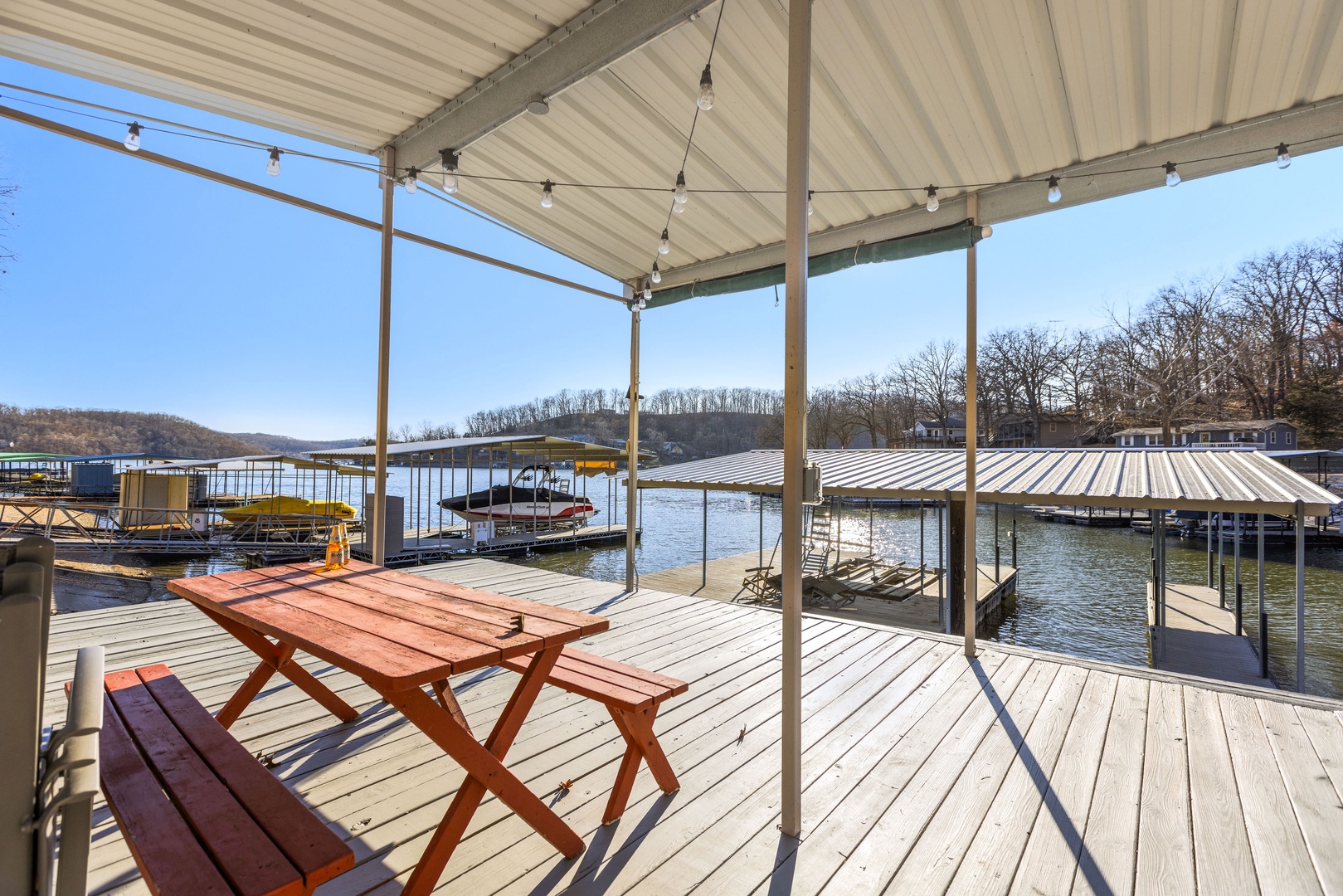 Enjoy hanging out on the dock with a 10x30 boat slip and two PWC lifts