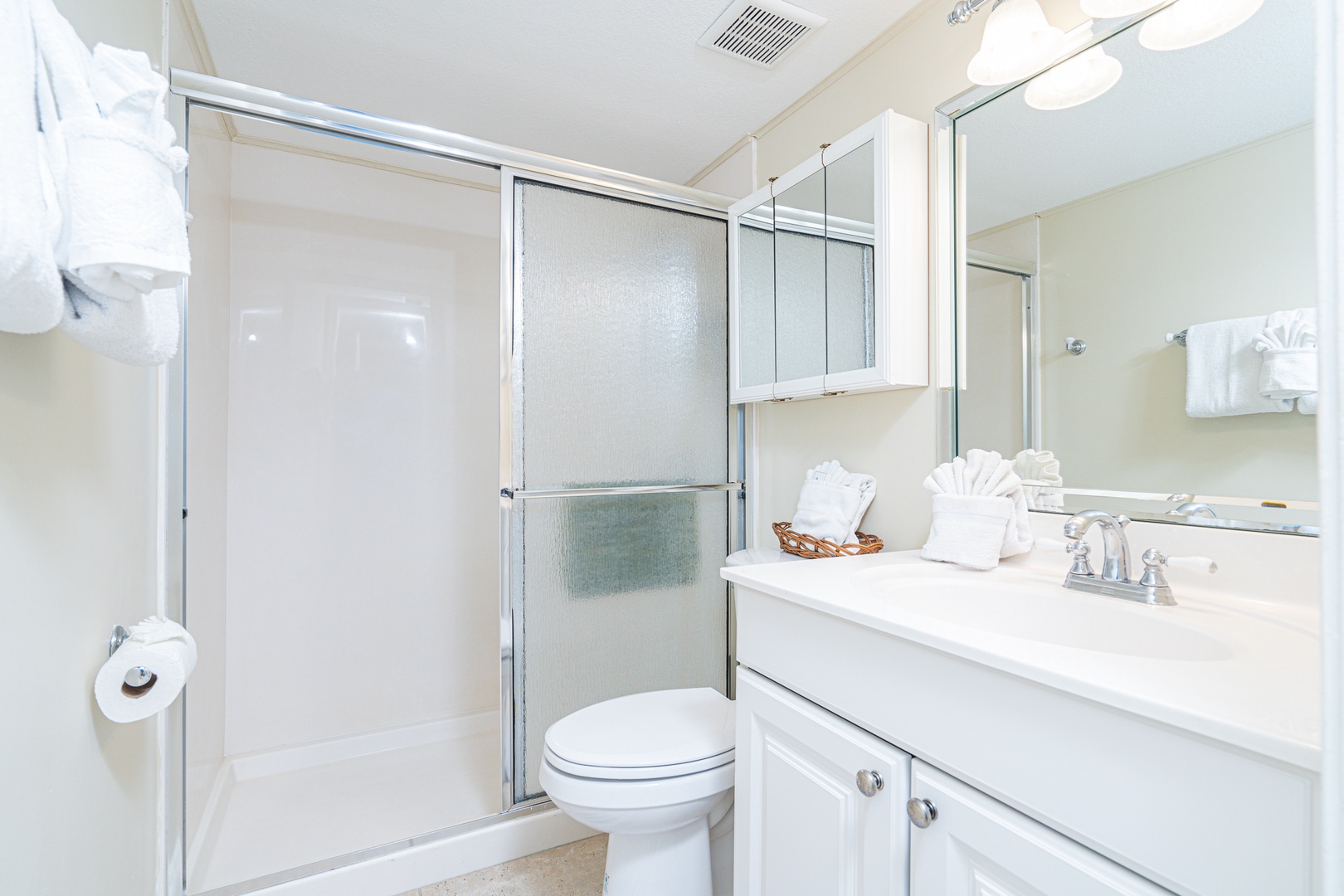 A single vanity & glass shower await in this ensuite bath