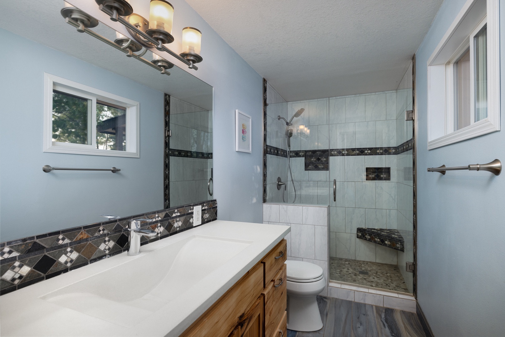 Wash up in the king ensuite, featuring a large single vanity & shower