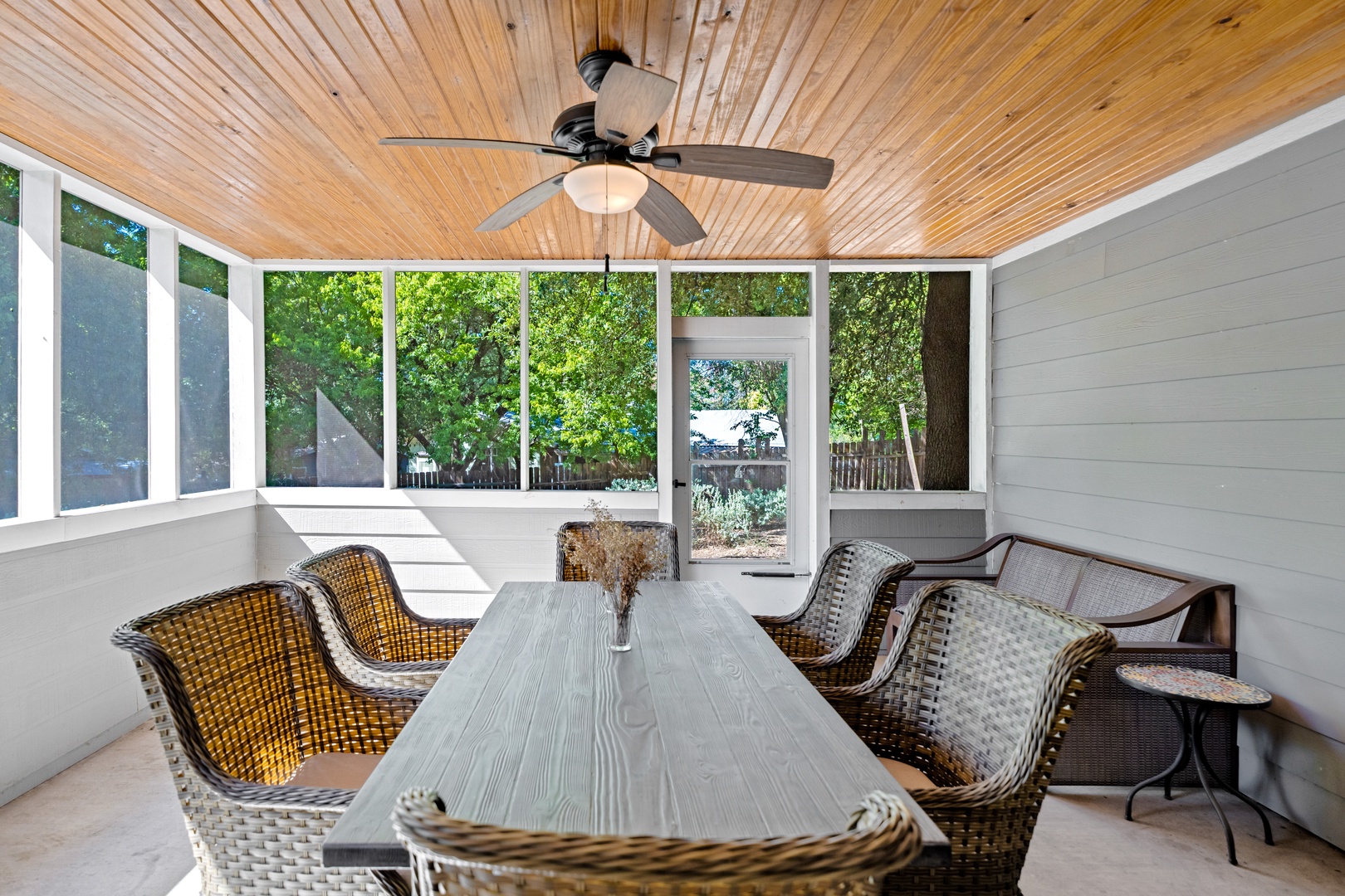 Screened porch with table and seating for 6